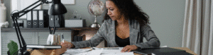 Stressed business owner working on documents related to ERC filings.